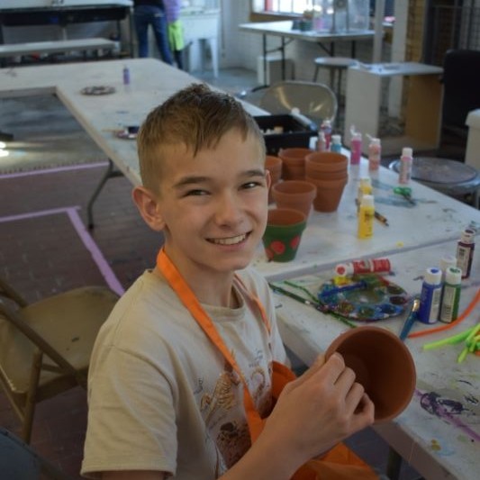 Picture of a childhood cancer hero working on art with Connors Heroes Art Sessions in Richmond VA