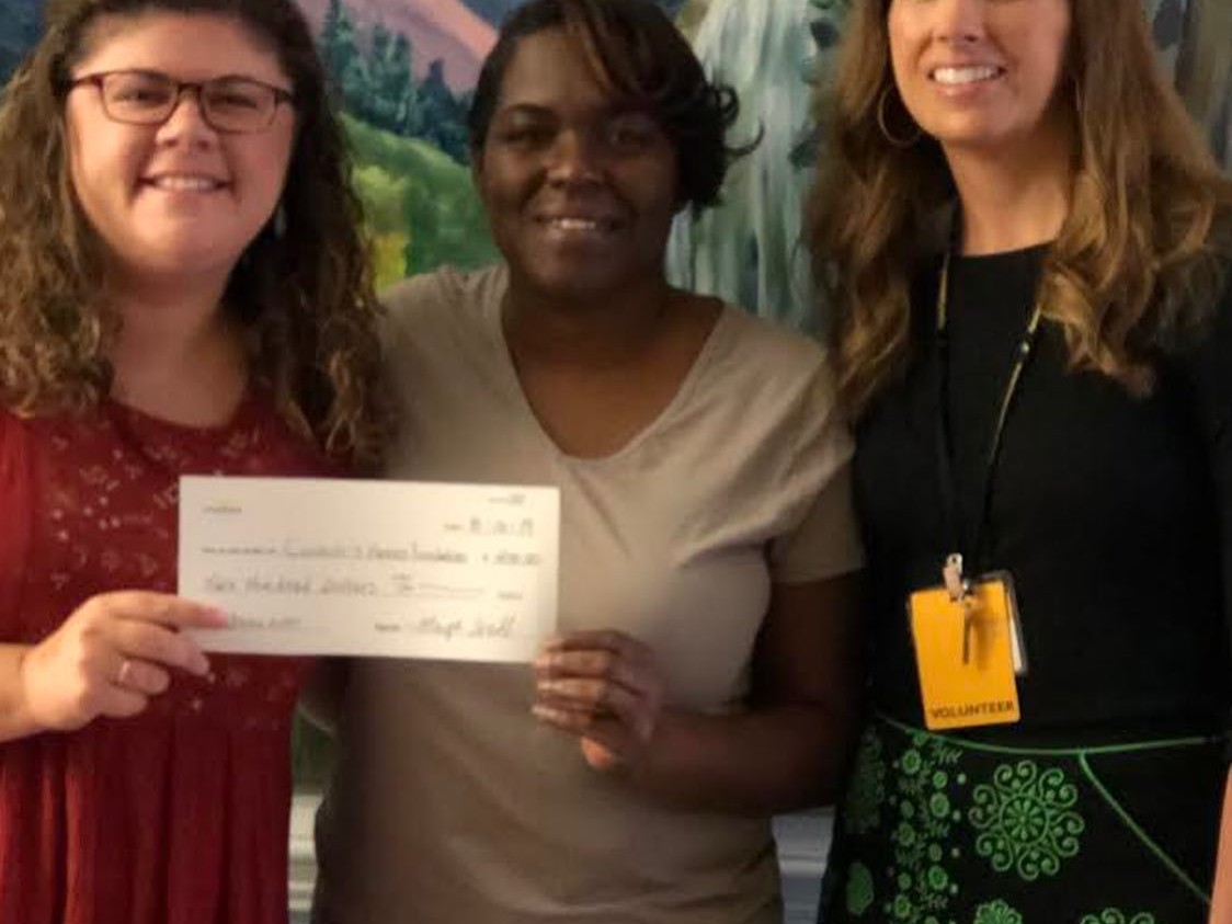 Celia and Erin receive a check from Maya's family