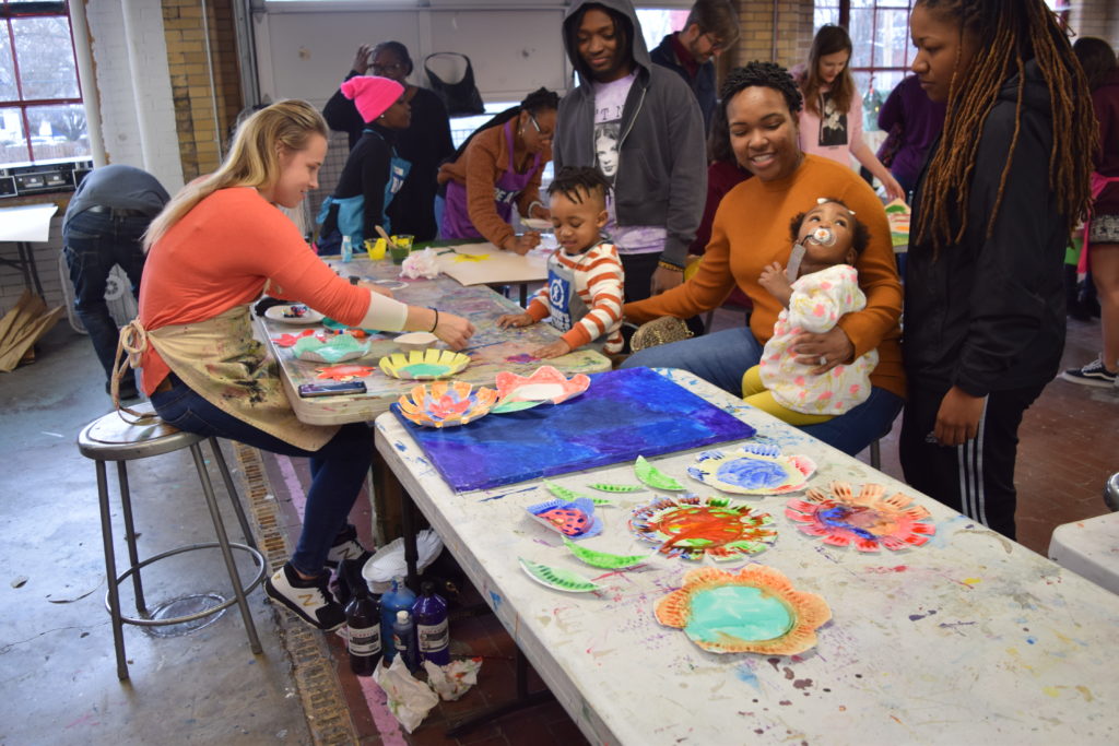Families paint together at the Connors Heroes Art Session