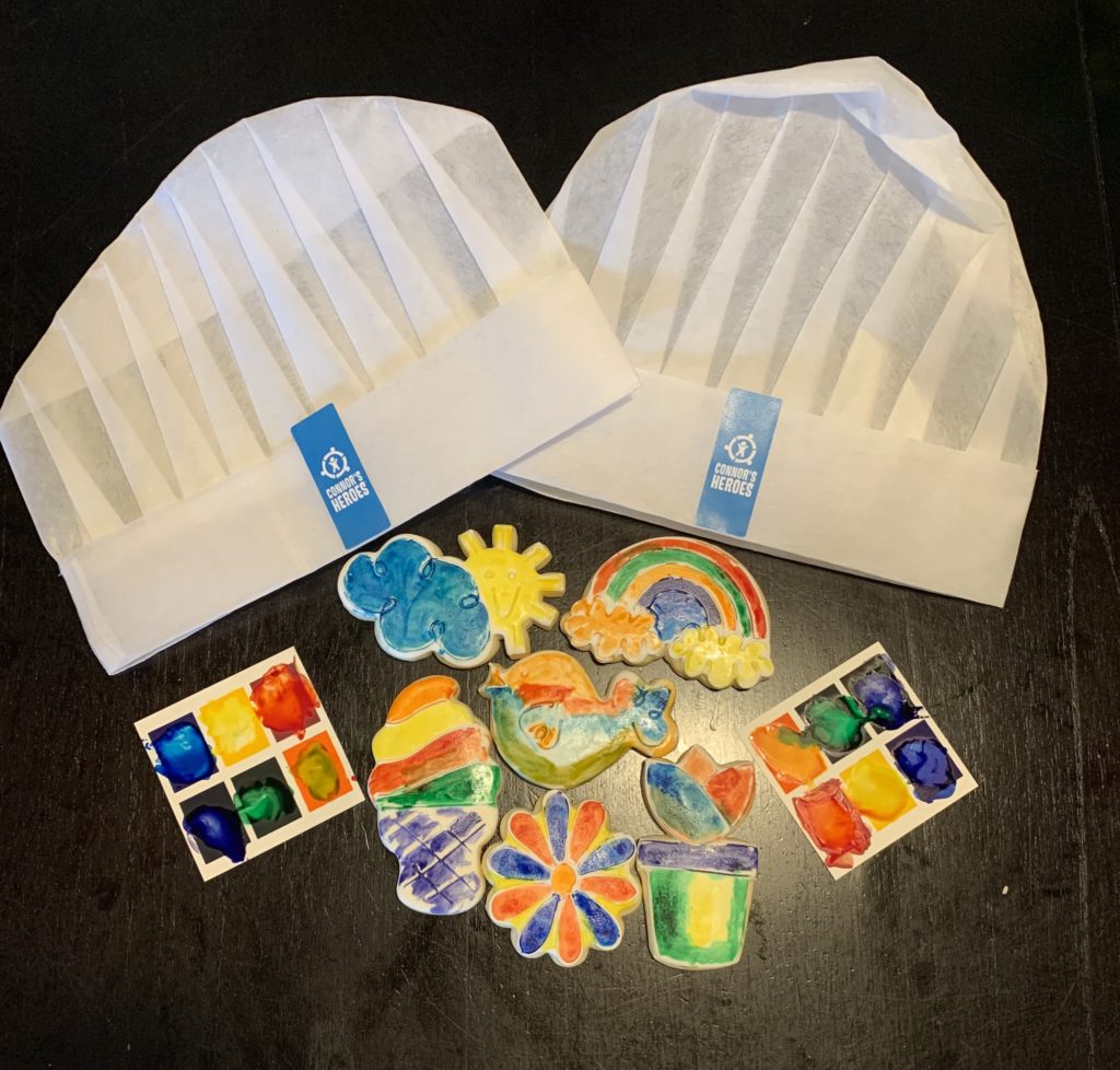 Connor's Heroes chef hats, paints and cookies decorated as flowers, rainbows