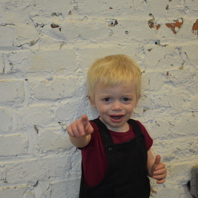 Toddler pointing to the camera
