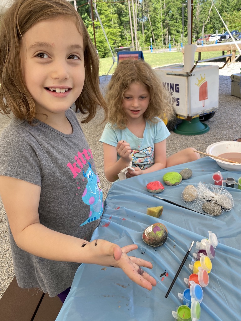 Image Two children painting rocks