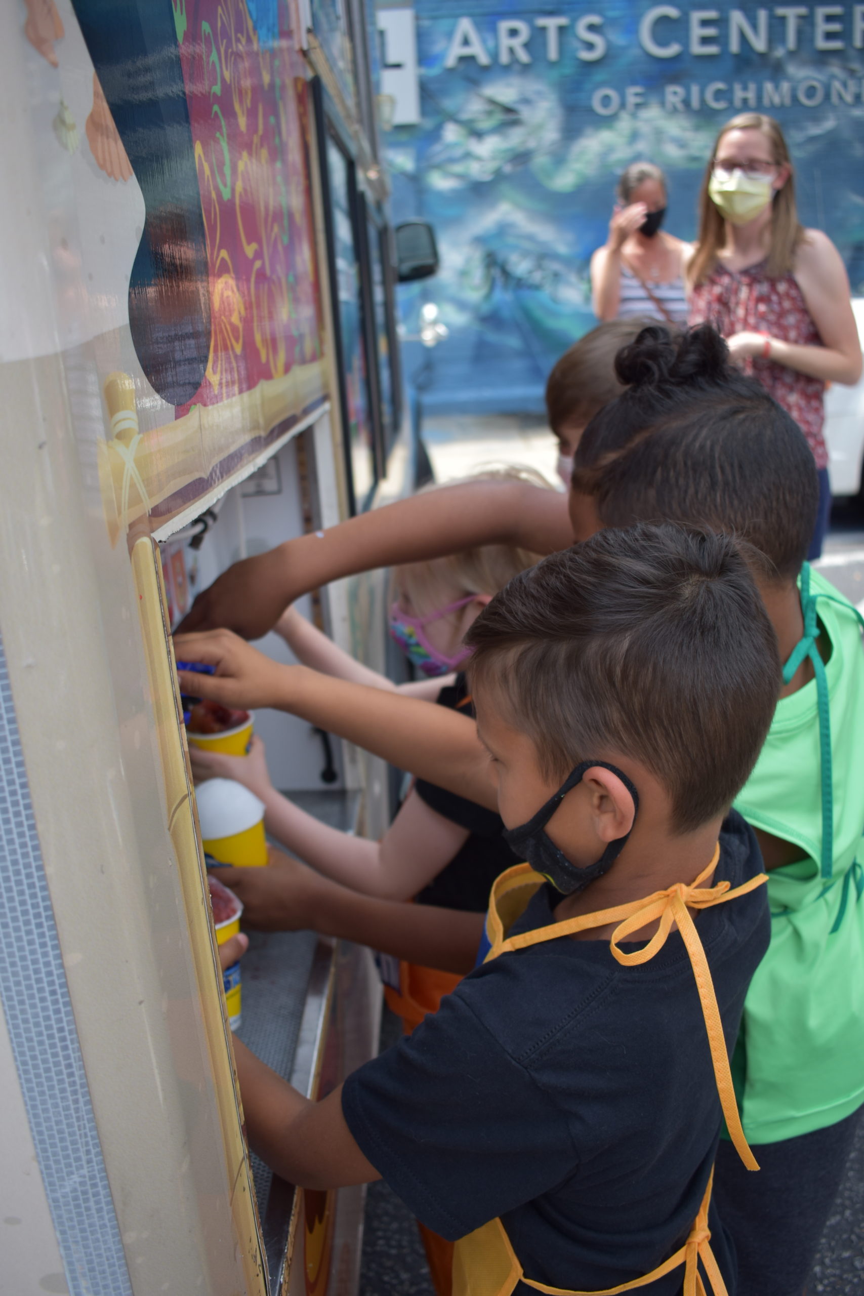 A group of children at an ice cream truck