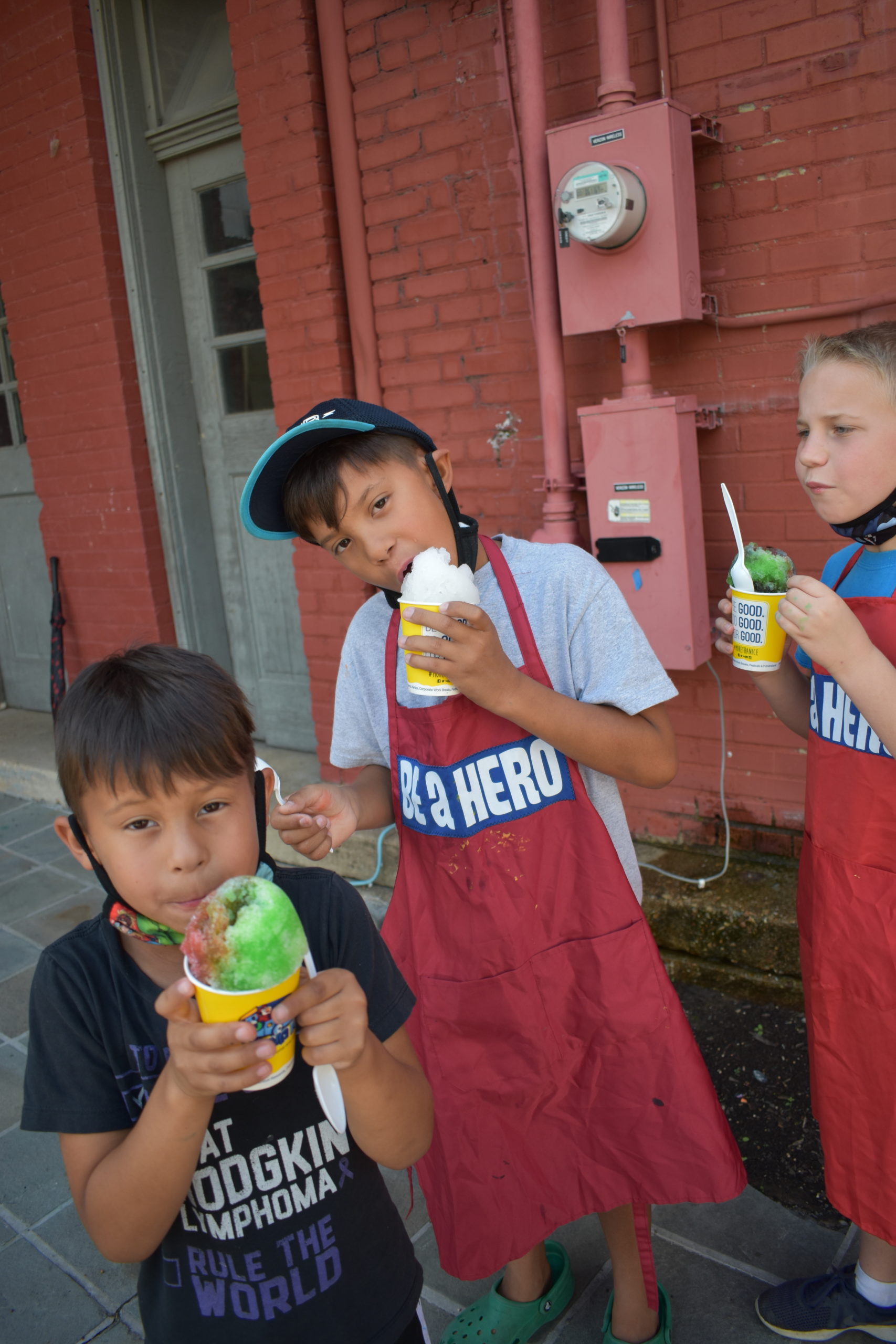 Image three boys eating ice cream