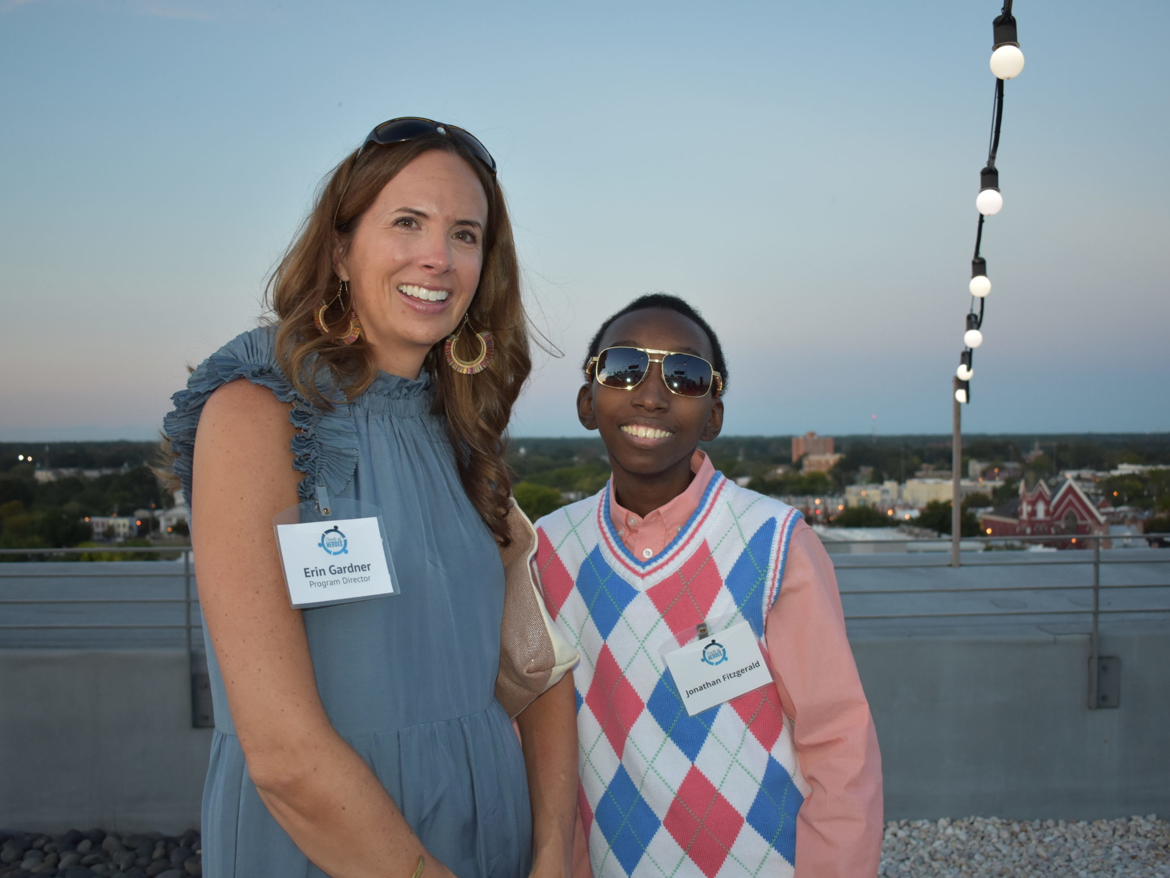 a woman standing with a teenager at a reception for Connors Heroes in Richmond Virginia