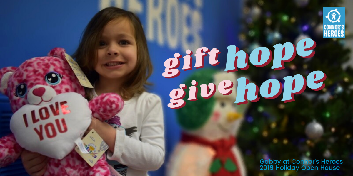 child holding a pink stuffed teddy bear who has a heart saying i love you text gift hope give hope