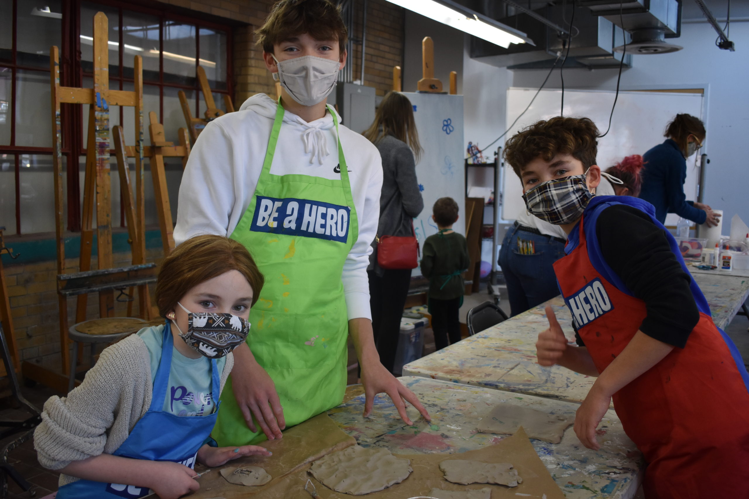Children in an art studio working on a craft together