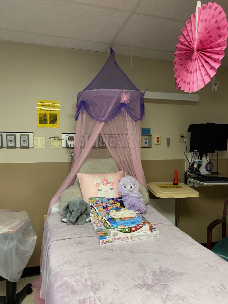 a hospital bed decorated with pillows