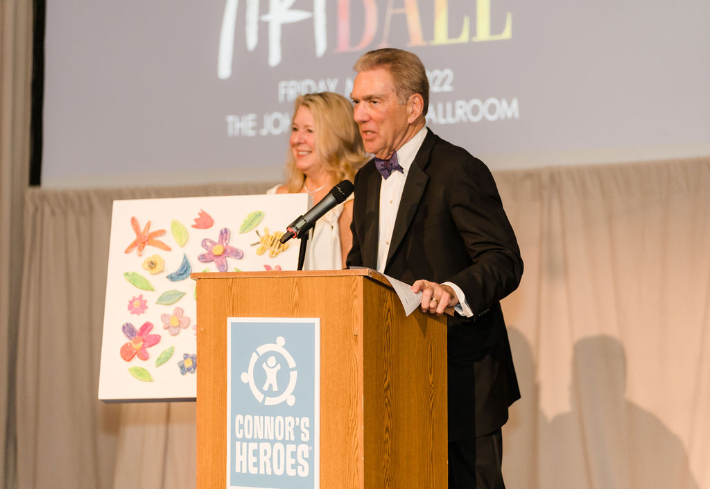 A man and a woman are speaking at the gala