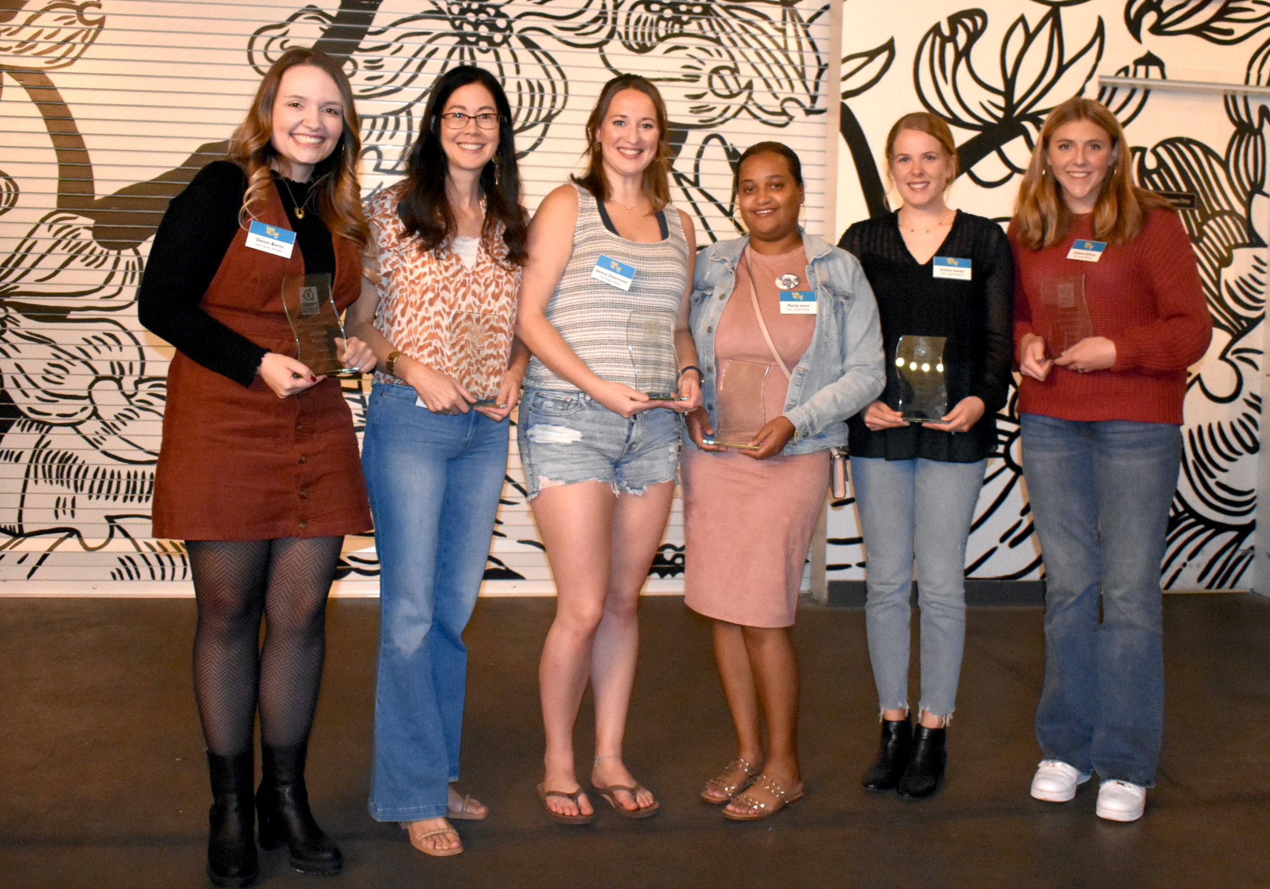 6 of the Hero Squad Members standing with their awards