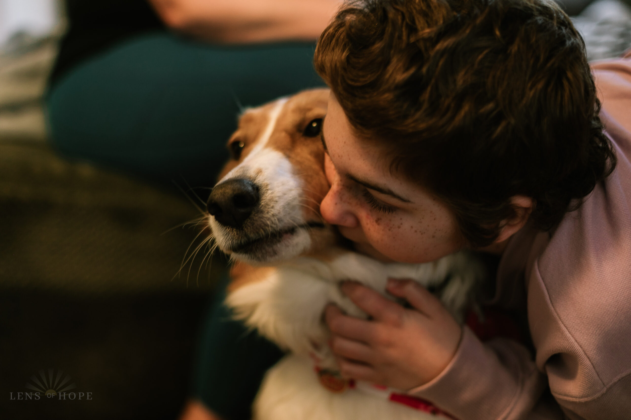 Olivia hugging her dog