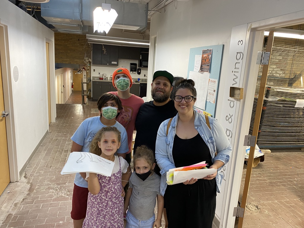 A family of five in an art studio