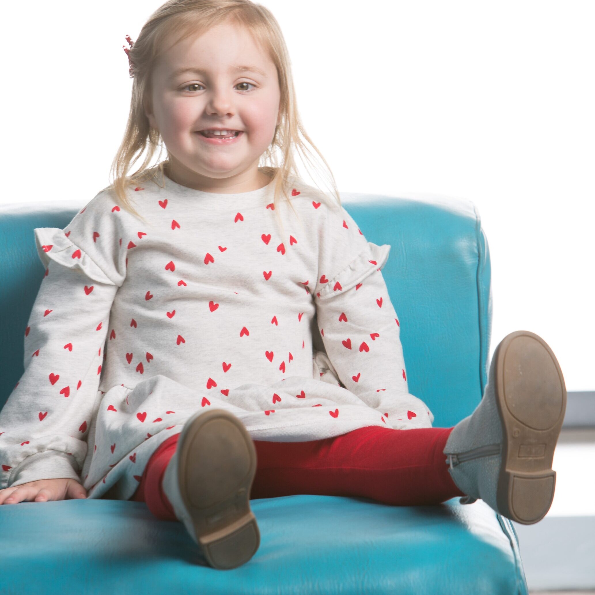 Ada sitting on a blue couch