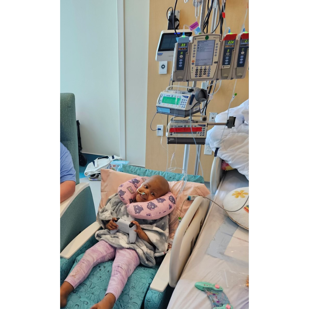 Willow is in her hospital room with an IV pole