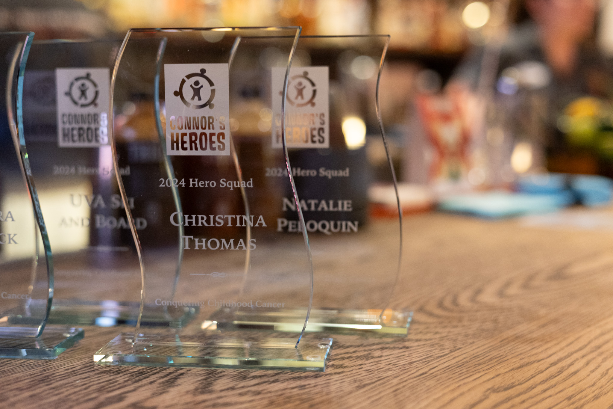 Three awards sit on a table