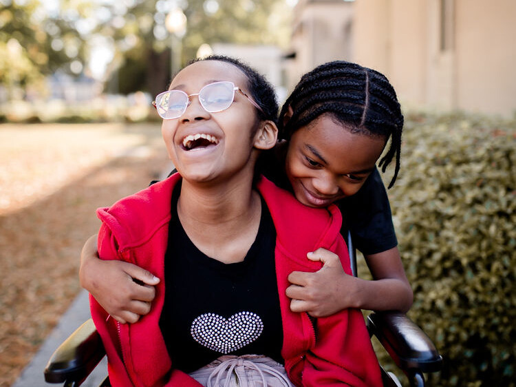 Photo of a boy hugging a girl