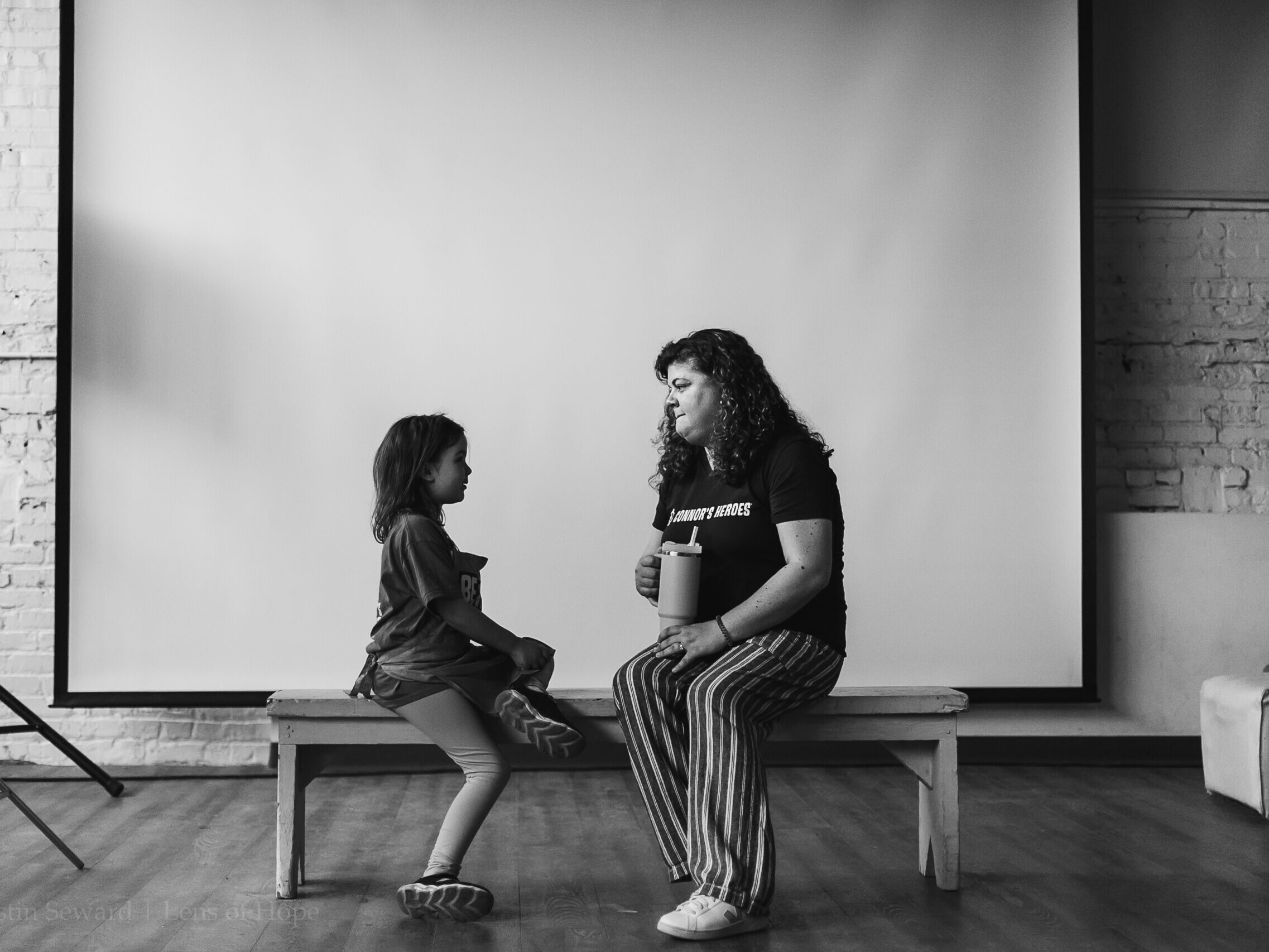 A child is talking with an adult