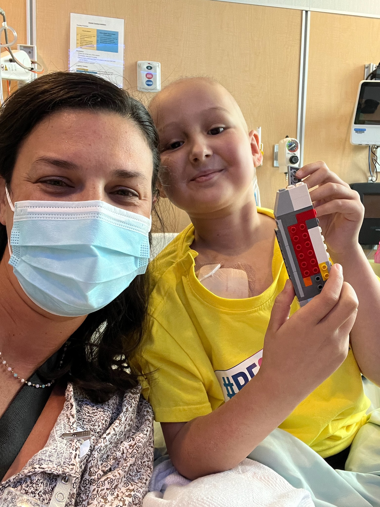 A girl is in the hospital with a woman