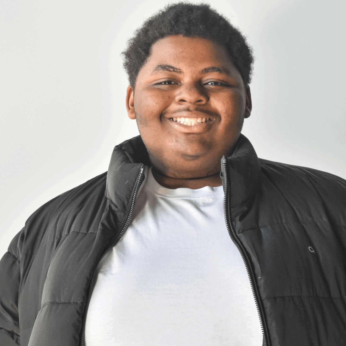 A teen poses for his photo
