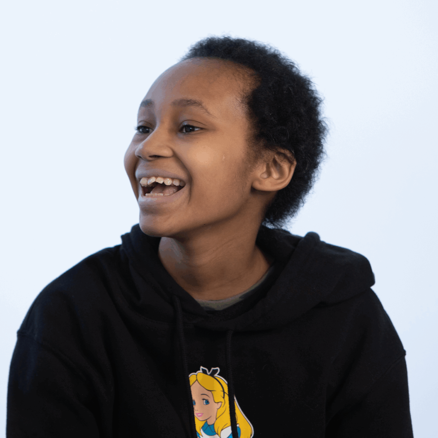 A teen poses for a phot
