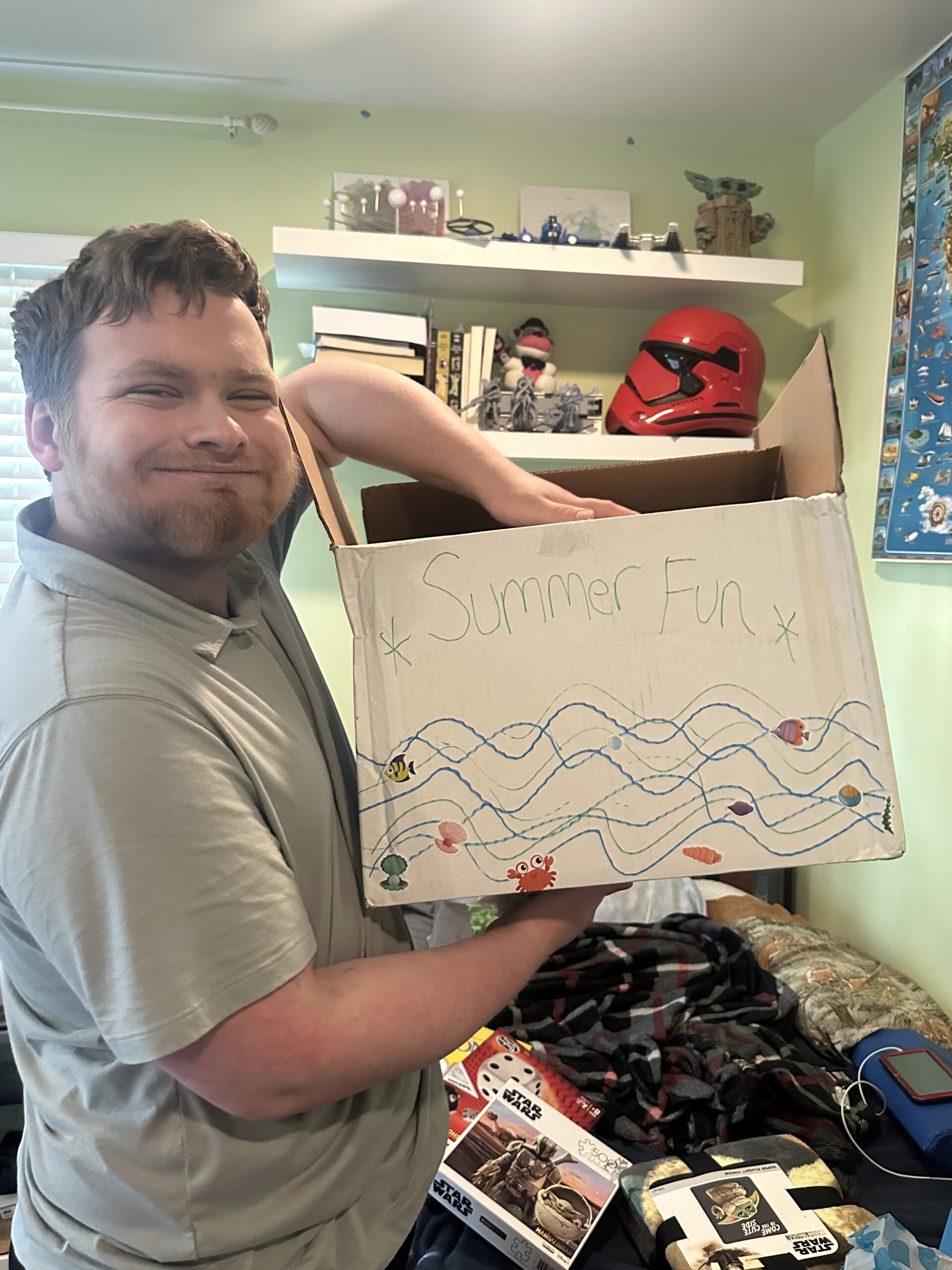 Boy with a box of titled summer fun